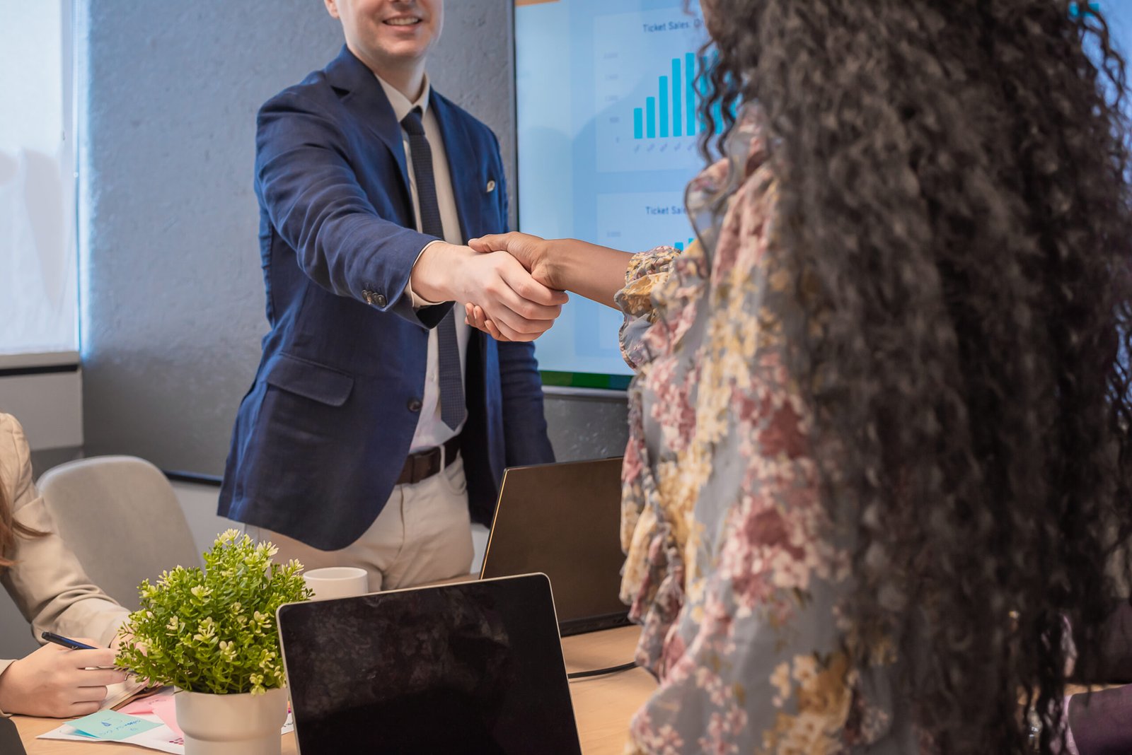 Business man shake hands with business women agreeing on partner