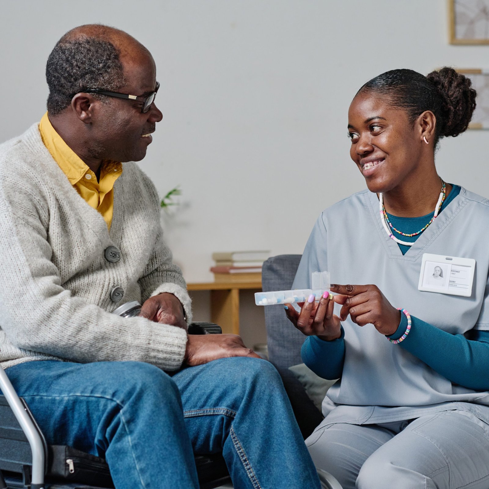caregiver-giving-pills-to-man-with-disability-2025-02-11-15-32-33-utc - Copy