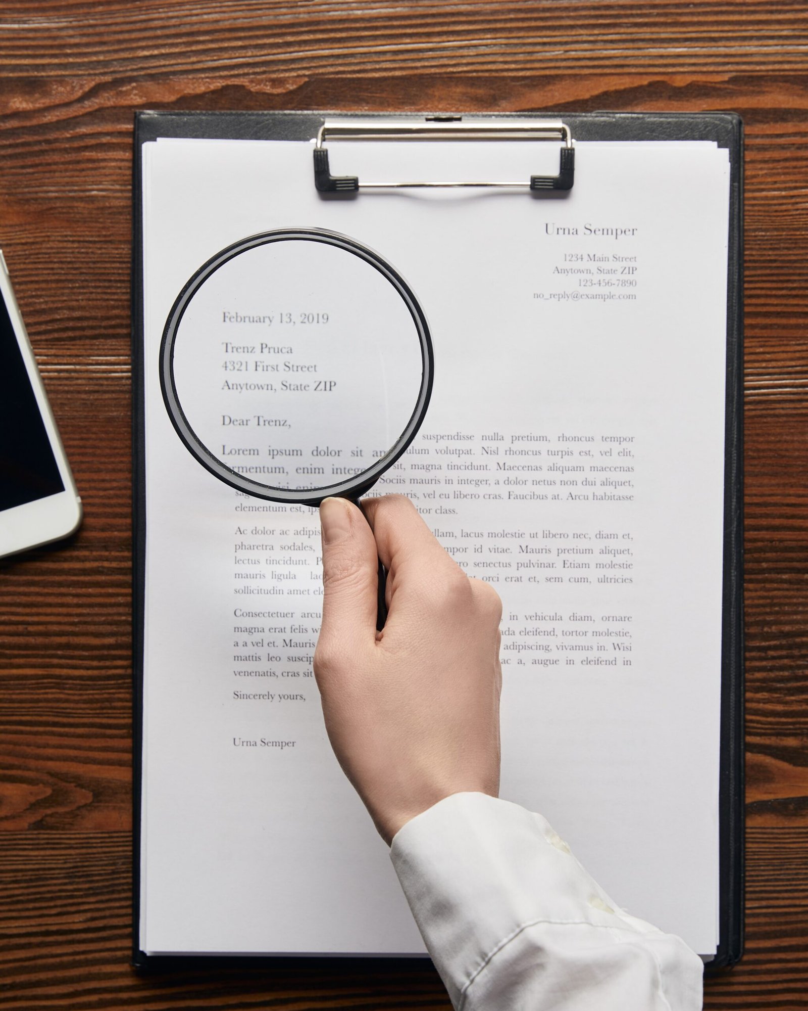 smiling older businessman holding document