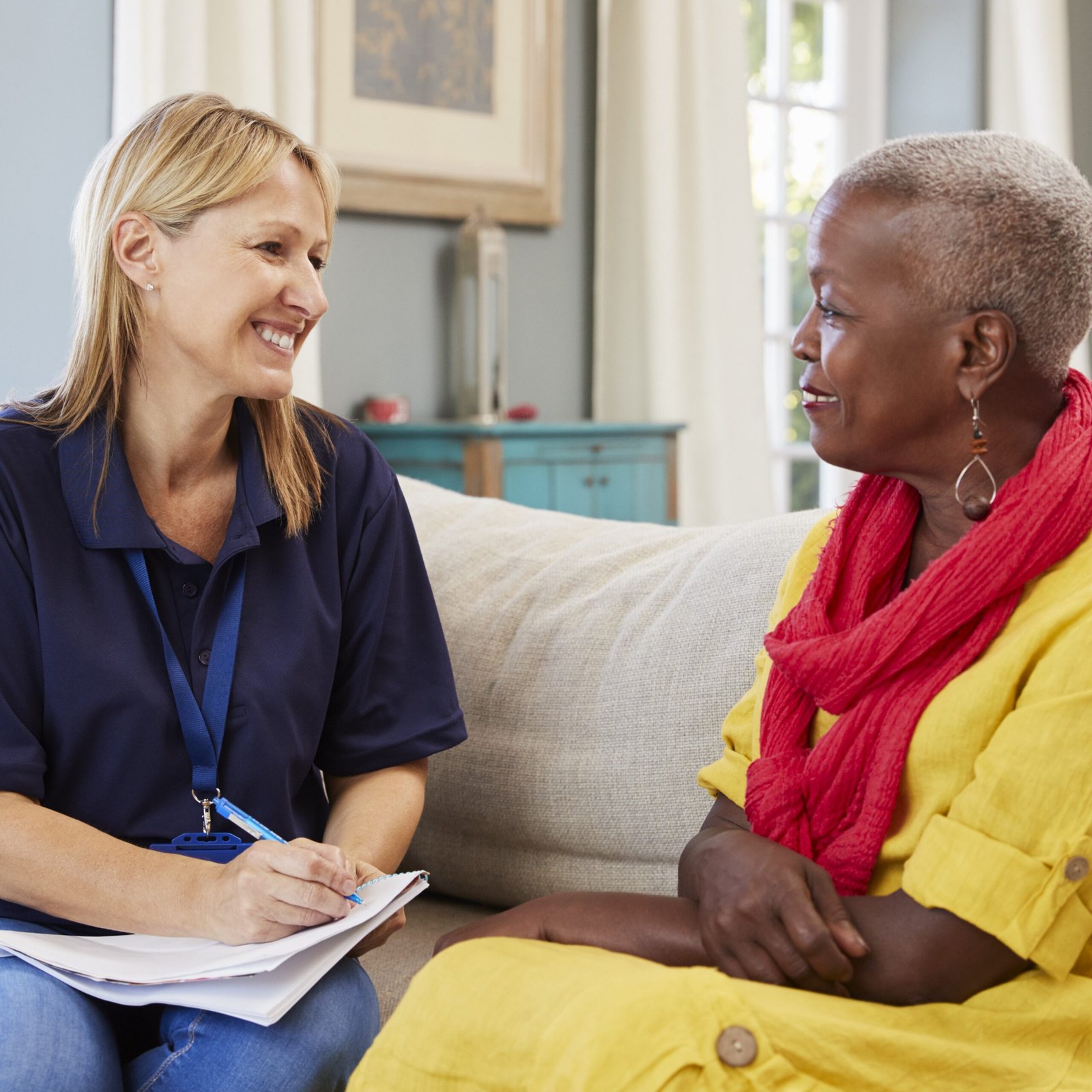 Female Support Worker Visits Senior Woman At Home